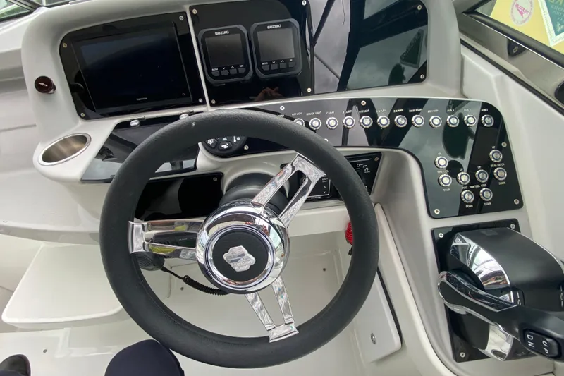  Yacht Photos Pics Cockpit of 2009 Formula 330 Sun Sport with steering wheel and control panel.