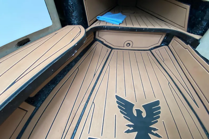  Yacht Photos Pics 2009 Formula 330 Sun Sport interior with custom flooring and eagle emblem.