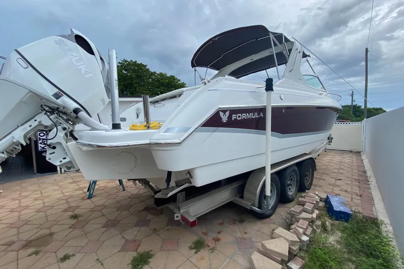  Yacht Photos Pics 2009 Formula 330 Sun Sport boat on trailer, featuring Suzuki outboard engines.