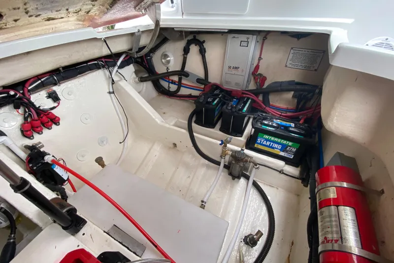  Yacht Photos Pics Engine compartment of a 2009 Formula 330 Sun Sport boat, featuring batteries and wiring.