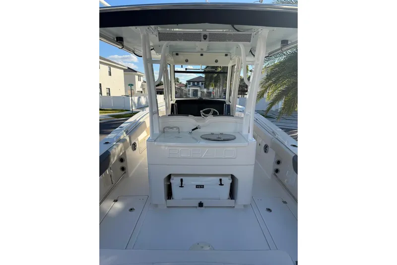  Yacht Photos Pics 2017 Robalo R302 Center Console boat interior with steering wheel and storage compartments.
