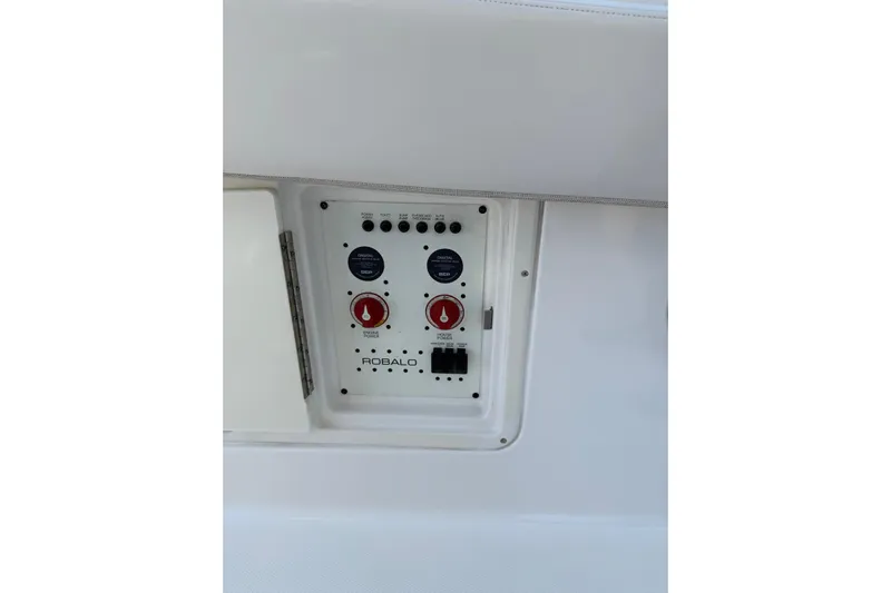  Yacht Photos Pics Control panel of 2017 Robalo R302 Center Console boat with switches and dials.
