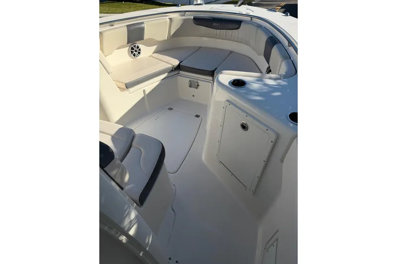  Yacht Photos Pics 2017 Robalo R302 Center Console boat interior with cushioned seating and storage compartments.