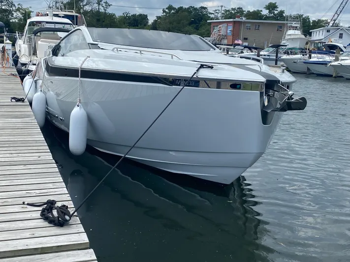 Just Us Yacht Photos Pics 2022 Fairline F//Line 33 yacht docked at a marina, showcasing sleek design and modern features.