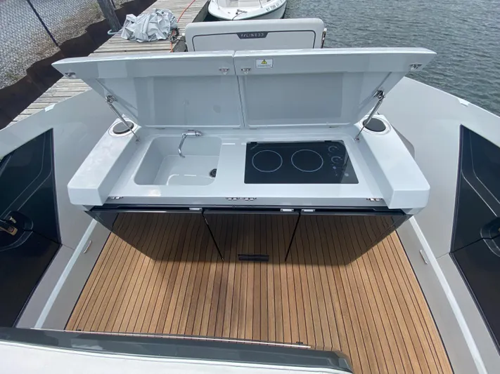 Just Us Yacht Photos Pics Outdoor kitchen on 2022 Fairline F//Line 33 yacht with sink and stove.