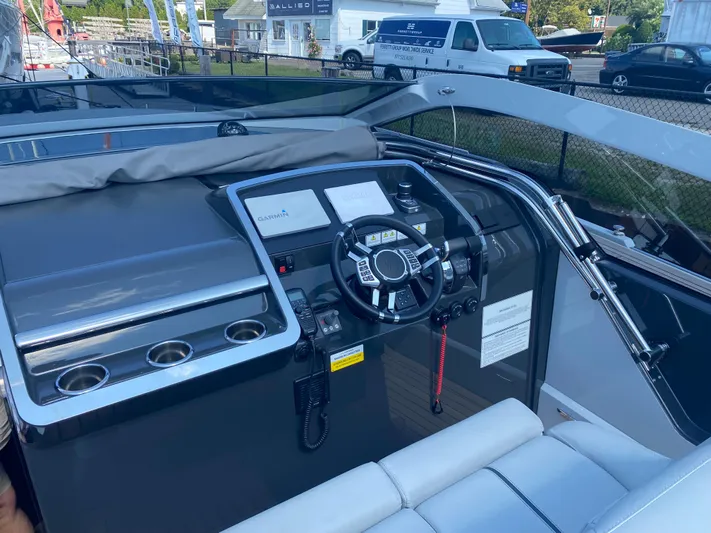 Just Us Yacht Photos Pics 2022 Fairline F//Line 33 cockpit with modern steering and control panel.