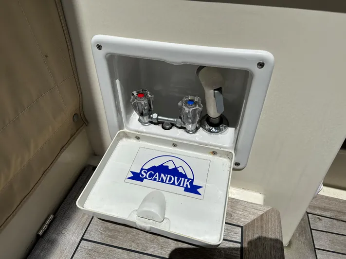  Yacht Photos Pics Outdoor shower controls on a 2001 Mast & Mallet 38 Picnic Boat, featuring Scandvik fixtures.