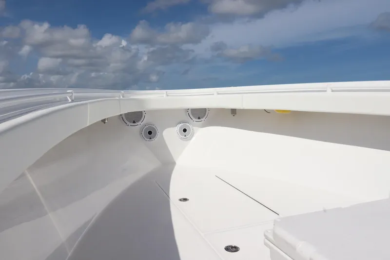  Yacht Photos Pics 2022 Onslow Bay 33 boat interior with speakers, under a partly cloudy sky.