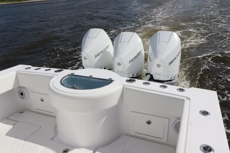  Yacht Photos Pics 2022 Onslow Bay 33 boat with triple Mercury engines on the water.