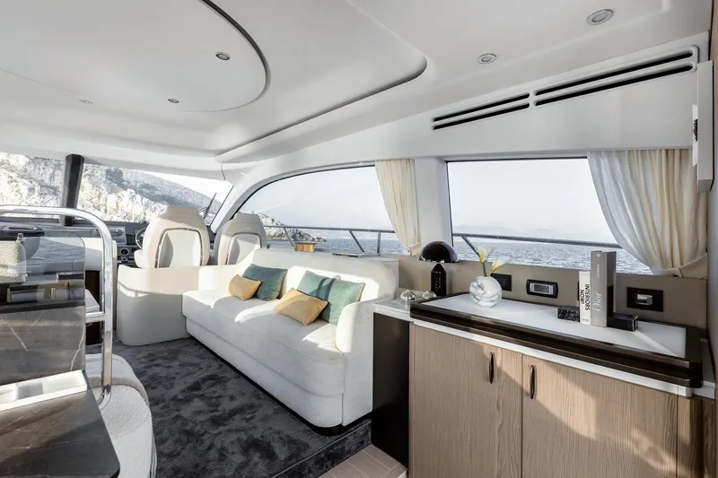 Azimut 53 Fly Yacht Photos Pics Luxurious interior of 2026 Azimut Fly 53 yacht with modern furnishings and ocean view.
