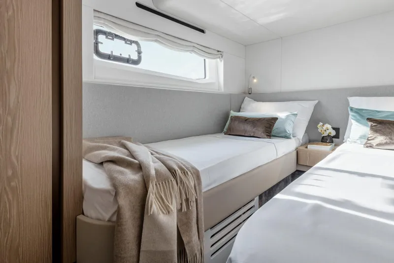 Azimut 53 Fly Yacht Photos Pics Luxurious twin cabin interior of 2026 Azimut Fly 53 yacht, featuring elegant bedding and decor.