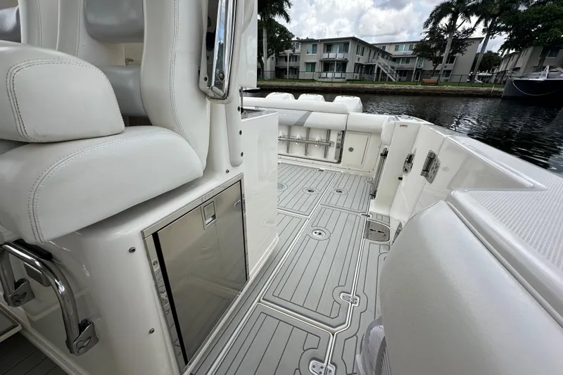 Yacht Photos Pics 2015 Boston Whaler 370 Outrage interior with white seating and sleek deck design.