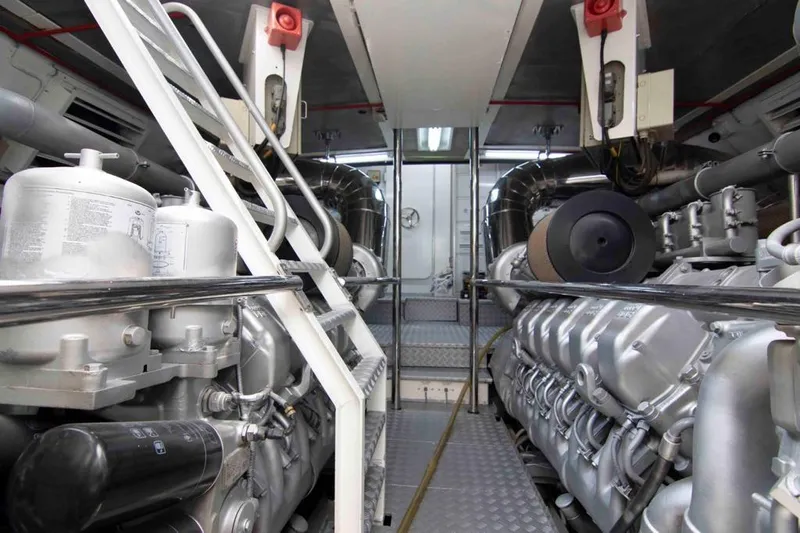  Yacht Photos Pics Engine room of a 1999 Mangusta 105 yacht, showcasing powerful machinery and equipment.