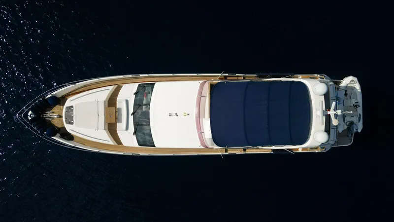  Yacht Photos Pics Overhead view of a 2012 Princess 72 yacht on dark water.