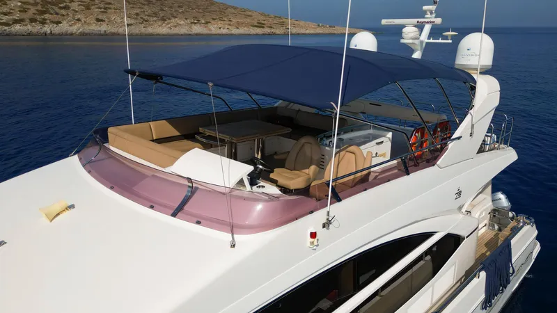  Yacht Photos Pics Luxury Princess 72 yacht, 2012 model, with spacious deck and canopy on calm waters.