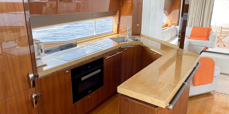  Yacht Photos Pics Luxurious kitchen interior on a 2012 Princess 72 yacht with modern amenities.