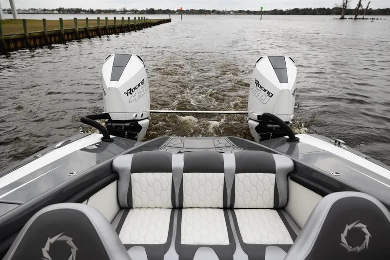  Yacht Photos Pics 2025 Fountain 34 Thundercat boat with dual engines on a calm waterway.