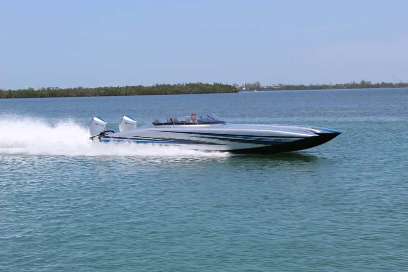  Yacht Photos Pics 2025 Fountain 34 Thundercat speedboat cruising on open water.