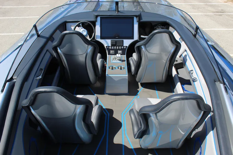  Yacht Photos Pics 2025 Fountain 34 Thundercat interior with four sleek seats and modern dashboard.