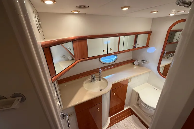 What Is Life Yacht Photos Pics Luxurious bathroom in 2000 Sunseeker Manhattan 62 yacht with elegant wood accents.