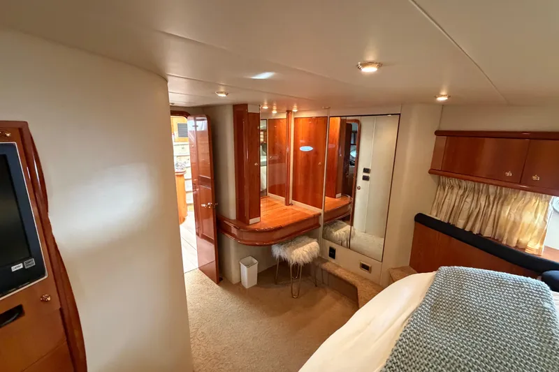 What Is Life Yacht Photos Pics Luxurious interior of 2000 Sunseeker Manhattan 62 yacht with elegant wood finishes.