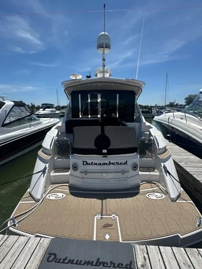 Outnumbered Yacht Photos Pics 2015 Regal 42 Sport Coupe yacht docked at marina, rear view.