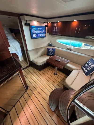 Outnumbered Yacht Photos Pics Luxurious interior of 2015 Regal 42 Sport Coupe with elegant seating and modern amenities.