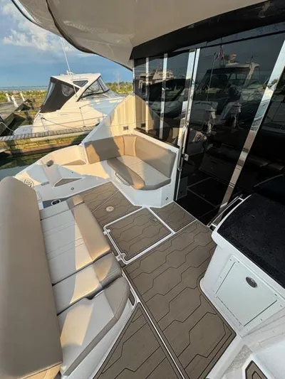 Outnumbered Yacht Photos Pics 2015 Regal 42 Sport Coupe yacht with spacious seating and sleek design.