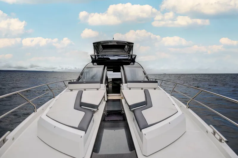  Yacht Photos Pics 2025 Galeon 640 Fly yacht on open sea with luxurious deck seating.