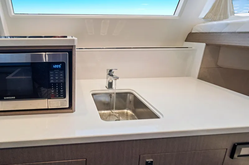  Yacht Photos Pics Modern kitchen area in 2025 Galeon 640 Fly yacht with sink and microwave.