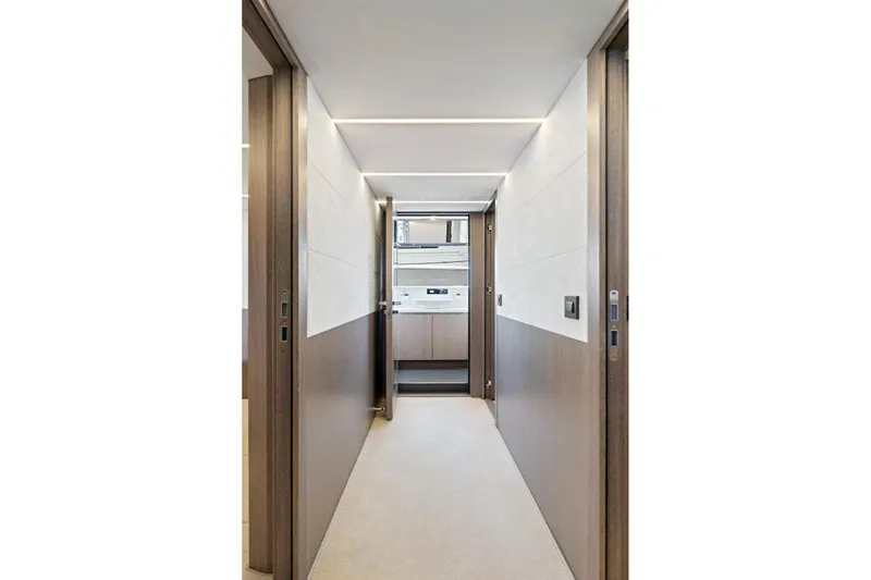  Yacht Photos Pics Hallway interior of 2025 Galeon 640 Fly yacht, featuring modern design and wood accents.
