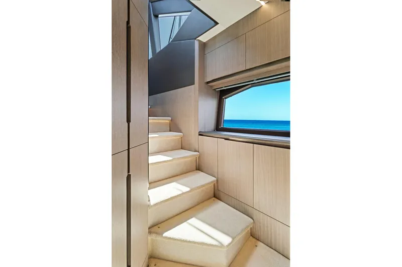  Yacht Photos Pics Luxurious interior staircase of 2025 Galeon 640 Fly yacht with ocean view.