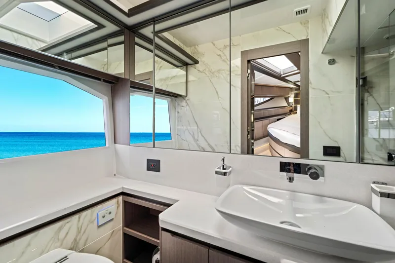  Yacht Photos Pics Luxurious bathroom interior of 2025 Galeon 640 Fly yacht with ocean view.