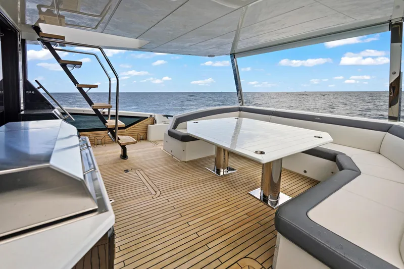  Yacht Photos Pics Luxurious 2025 Galeon 640 Fly yacht deck with elegant seating and ocean view.