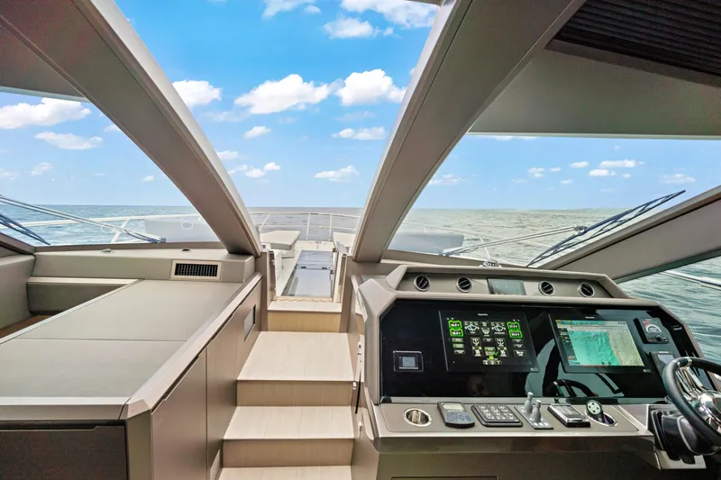  Yacht Photos Pics 2025 Galeon 640 Fly yacht cockpit with modern navigation systems and ocean view.