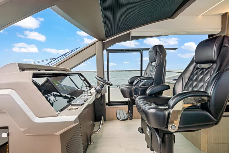  Yacht Photos Pics Luxurious cockpit of 2025 Galeon 640 Fly yacht with leather seats and modern controls.