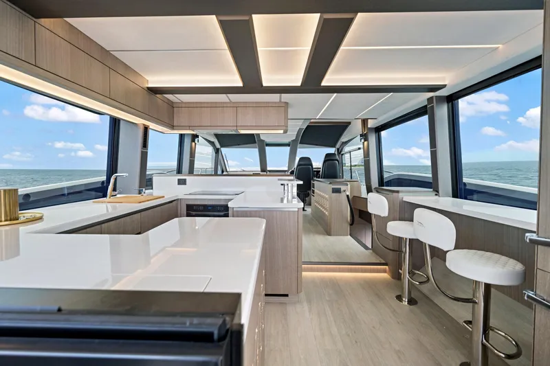  Yacht Photos Pics Luxurious interior of 2025 Galeon 640 Fly yacht with modern kitchen and ocean view.