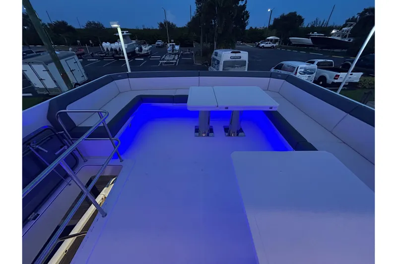 Yacht Photos Pics Luxurious 2025 Galeon 640 Fly yacht deck with blue LED lighting and seating area.