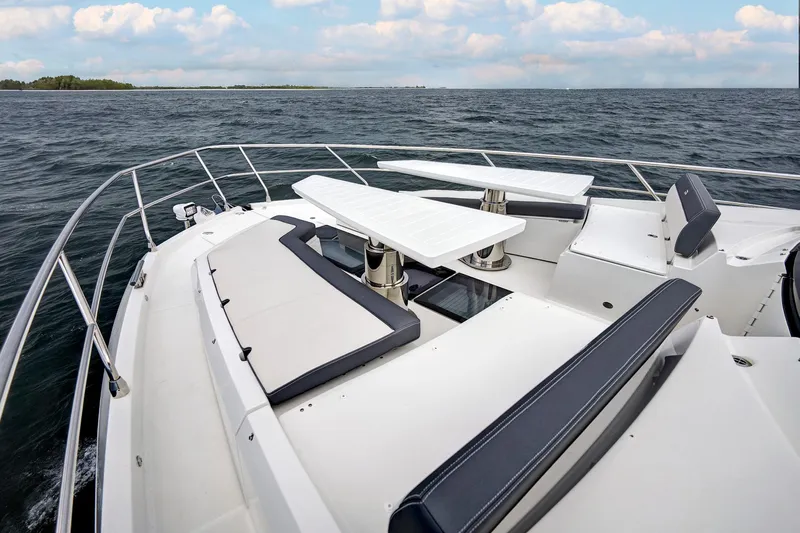  Yacht Photos Pics 2025 Galeon 640 Fly yacht deck with seating and tables, ocean view.