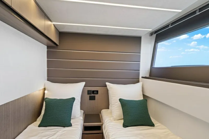  Yacht Photos Pics Luxurious cabin interior of 2025 Galeon 640 Fly yacht with twin beds and modern design.