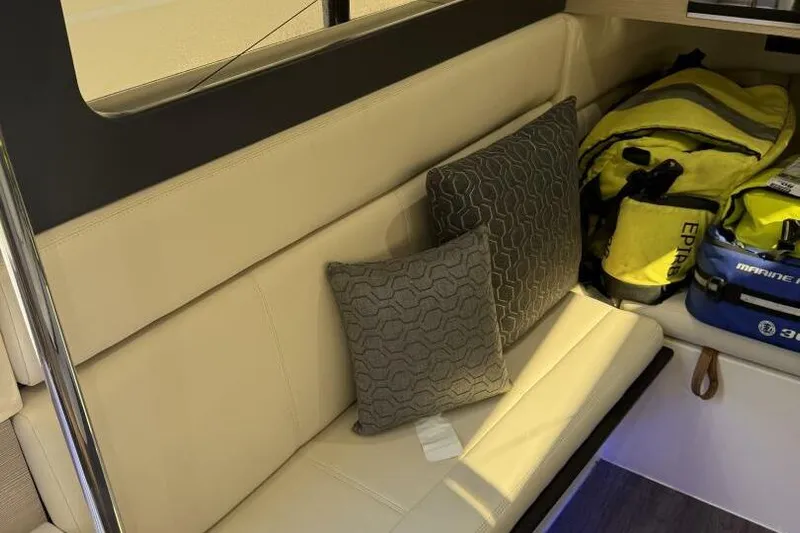  Yacht Photos Pics Luxurious interior of 2022 Scout 425 LXF boat with cushions and gear bags.