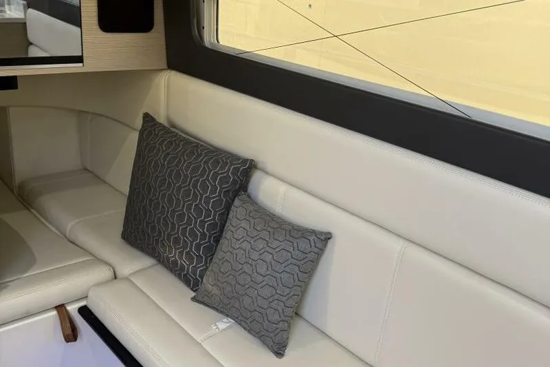  Yacht Photos Pics Luxurious interior of 2022 Scout 425 LXF boat with elegant seating and decorative pillows.