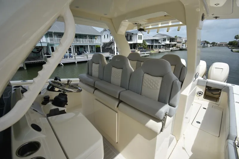  Yacht Photos Pics 2022 Scout 425 LXF boat interior with luxurious seating and waterfront view.