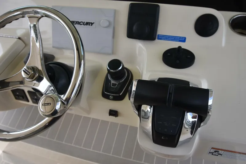  Yacht Photos Pics Steering wheel and controls of 2022 Scout 425 LXF boat cockpit.