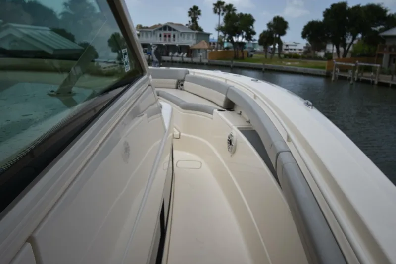  Yacht Photos Pics 2022 Scout 425 LXF boat deck with sleek design and waterfront view.