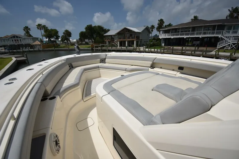  Yacht Photos Pics Luxurious 2022 Scout 425 LXF boat interior with plush seating and waterfront view.