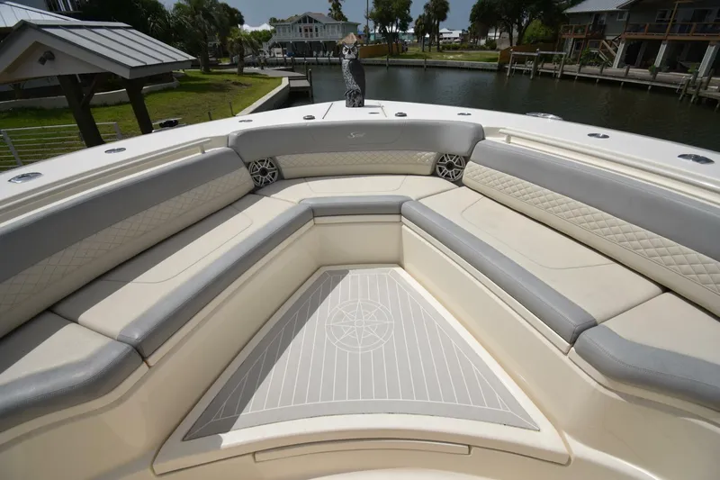  Yacht Photos Pics Luxurious seating area on 2022 Scout 425 LXF boat, featuring elegant upholstery and spacious design.