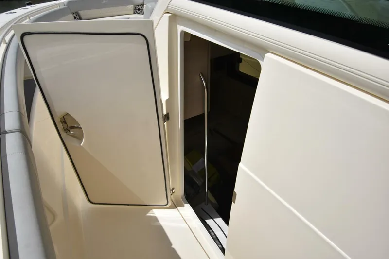 Yacht Photos Pics 2022 Scout 425 LXF boat cabin entrance with open door, showcasing interior access.
