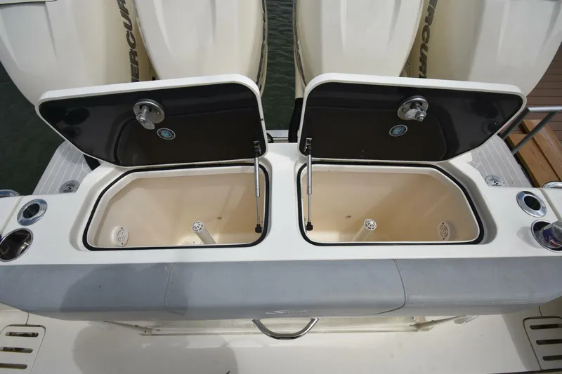  Yacht Photos Pics 2022 Scout 425 LXF boat with open storage compartments and Mercury engines.