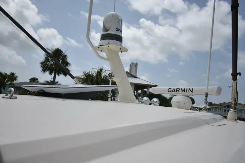  Yacht Photos Pics 2022 Scout 425 LXF boat with Garmin equipment under a cloudy sky.